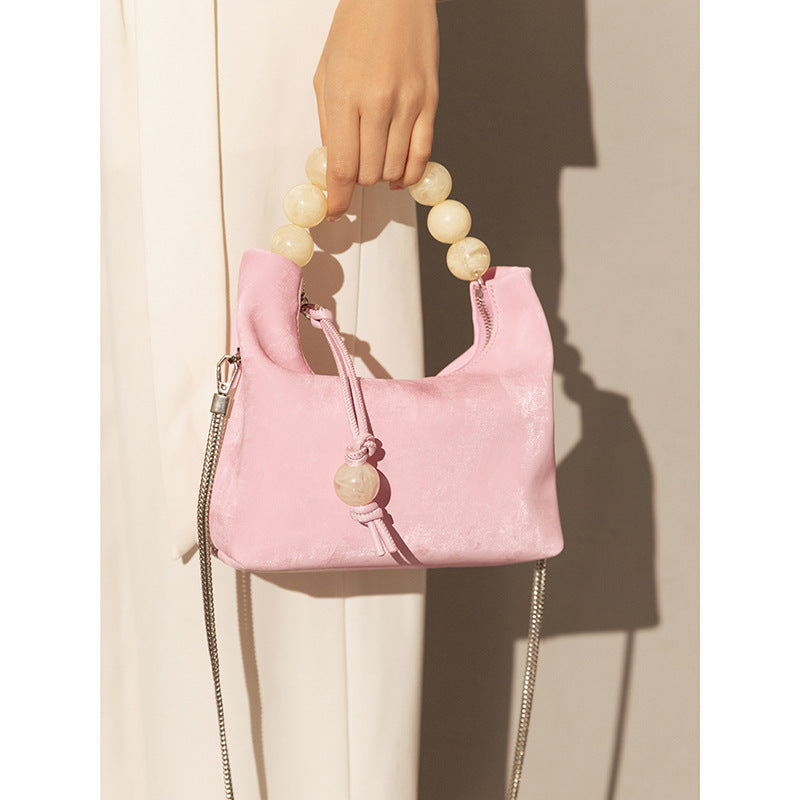 Sac à main à bandoulière avec chaîne en perles et bandoulière de niche