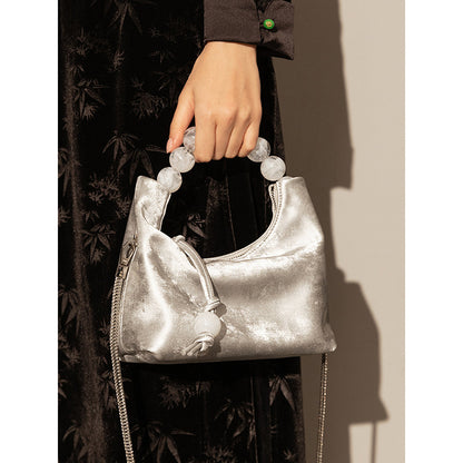 Sac à main à bandoulière avec chaîne en perles et bandoulière de niche
