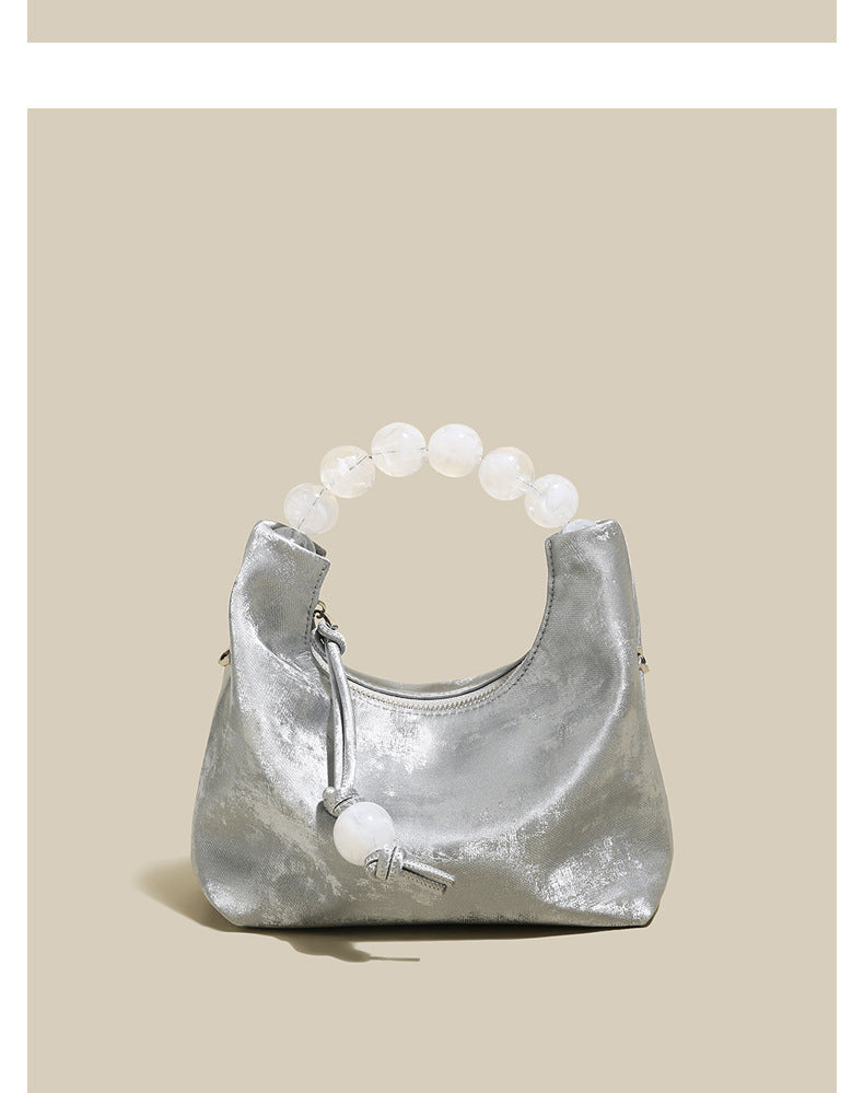 Sac à main à bandoulière avec chaîne en perles et bandoulière de niche