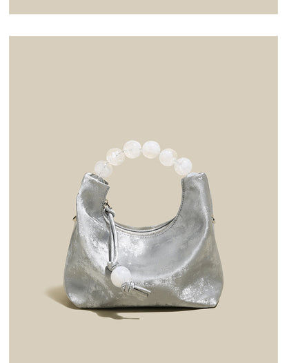 Sac à main à bandoulière avec chaîne en perles et bandoulière de niche